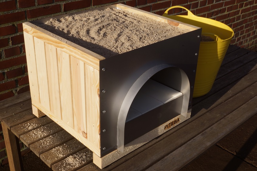 the PITEBA oven is completely filled with sand
